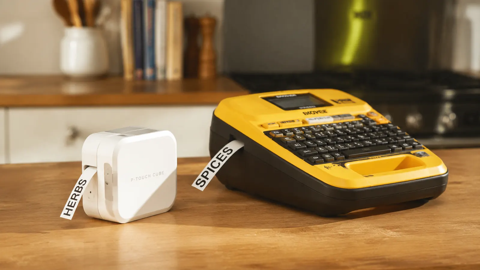 Brother P-Touch PTD220 label maker sitting on a pantry shelf next to labeled storage bins